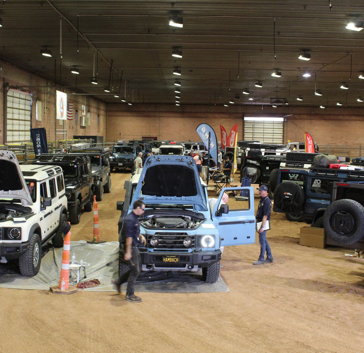 Hood up, hands on: training happens around the trucks.